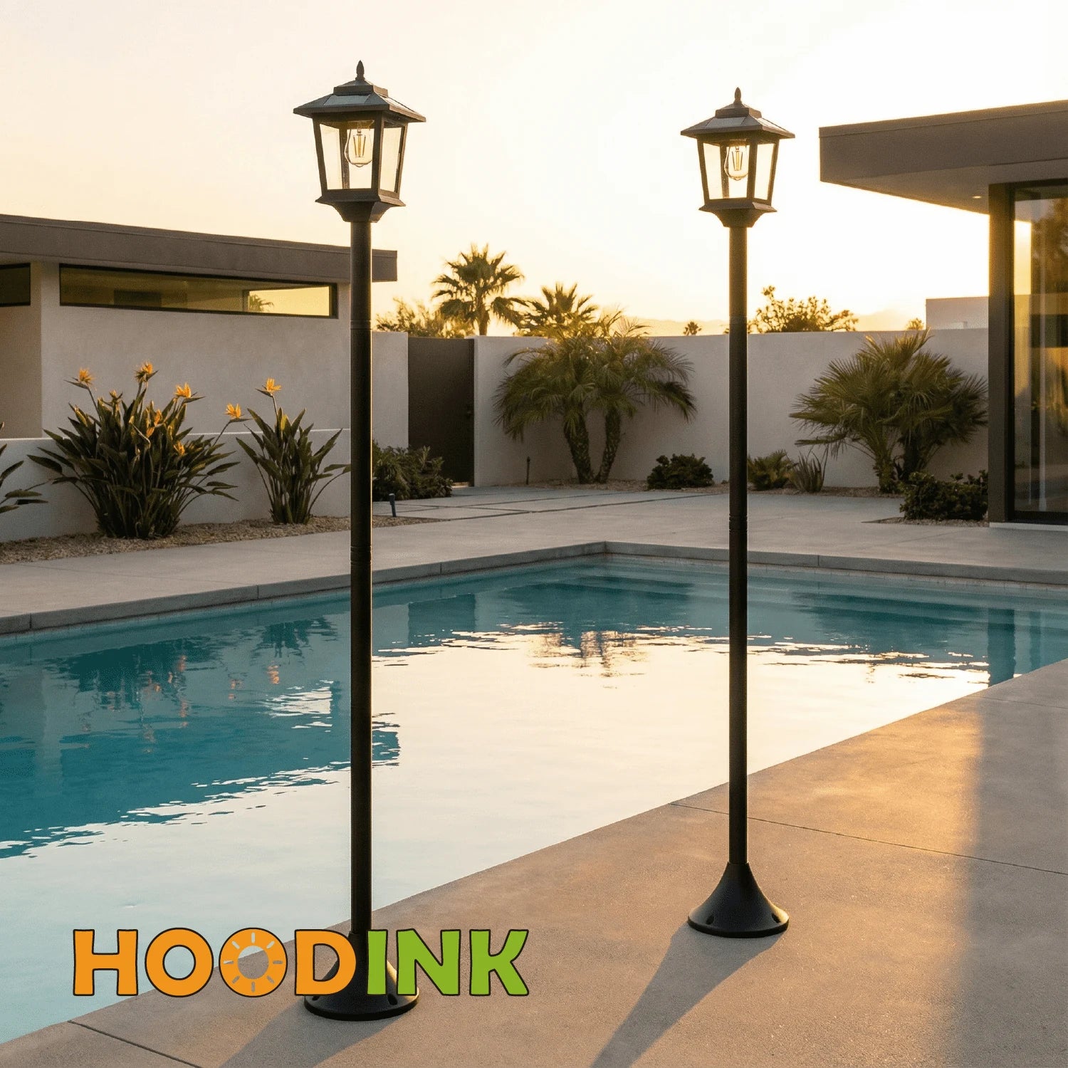 Matching black solar lamp posts beside a patio